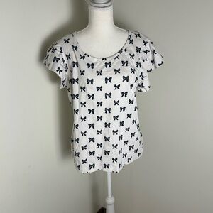 Kate Quinn White Top with Black Bow Pattern